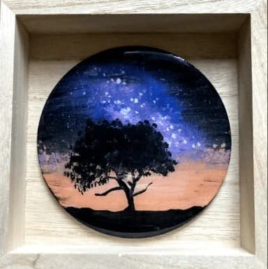 Black tree on the black space background with purple northern lights