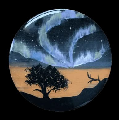 Black tree on the black space background with purple northern lights