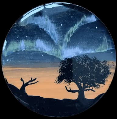 Black trees on the black space background with purple northern lights